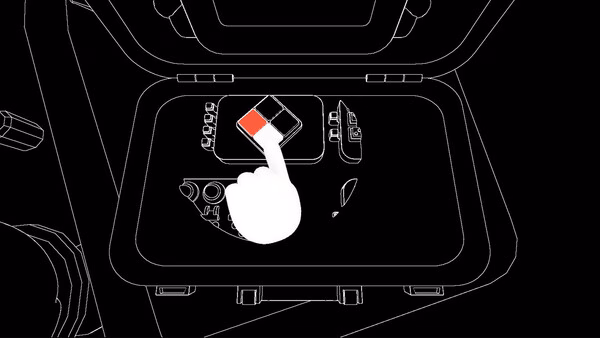 BOMBANANA! screenshot: white cartoon hand holds red cube over control panel with symbols.