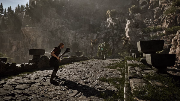 A Gothic 1 Remake screenshot showing a warrior with a mace facing a large green creature on a stone bridge in a mountainous area.