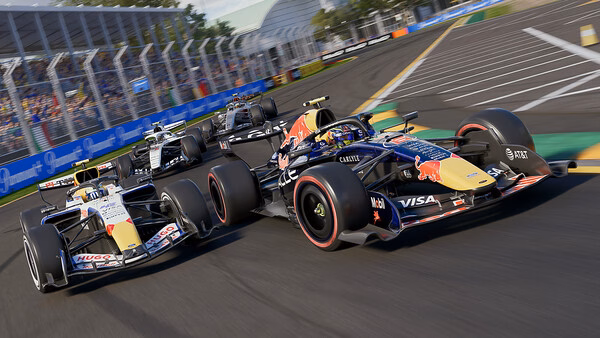 F1 25 screenshot: Close-up of Formula 1 cars racing on a sunny day, with detailed track and vibrant sponsor logos visible.
